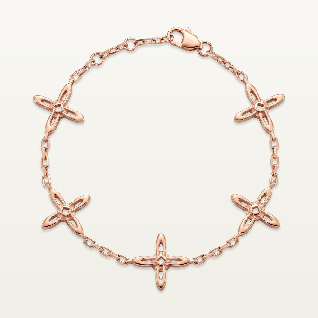 Ovis & Co. Celestial Armband Roségold – Edelstahlarmband mit 5 filigranen Kreuz-Anhängern, langlebige Veredelung, designed in Frankfurt